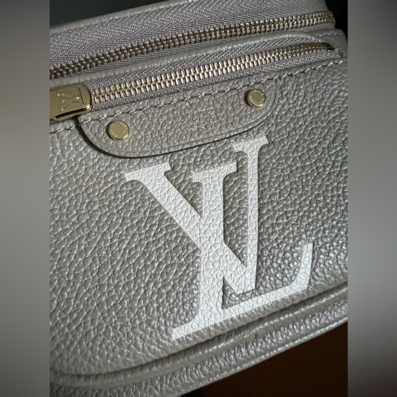 Brand new Louis Vuitton mini bumbag in bicolor monogram empreinte leather. - Picture 12 of 16